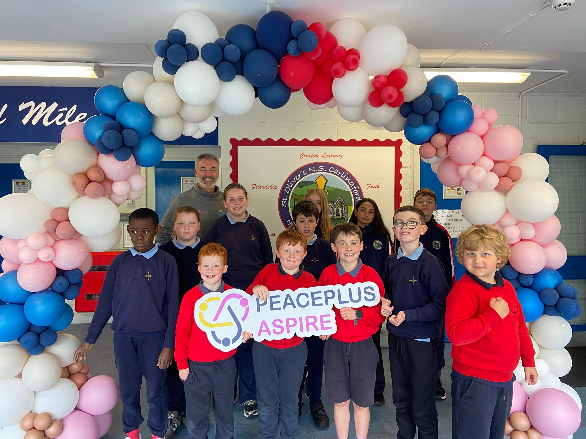 group under balloon arch